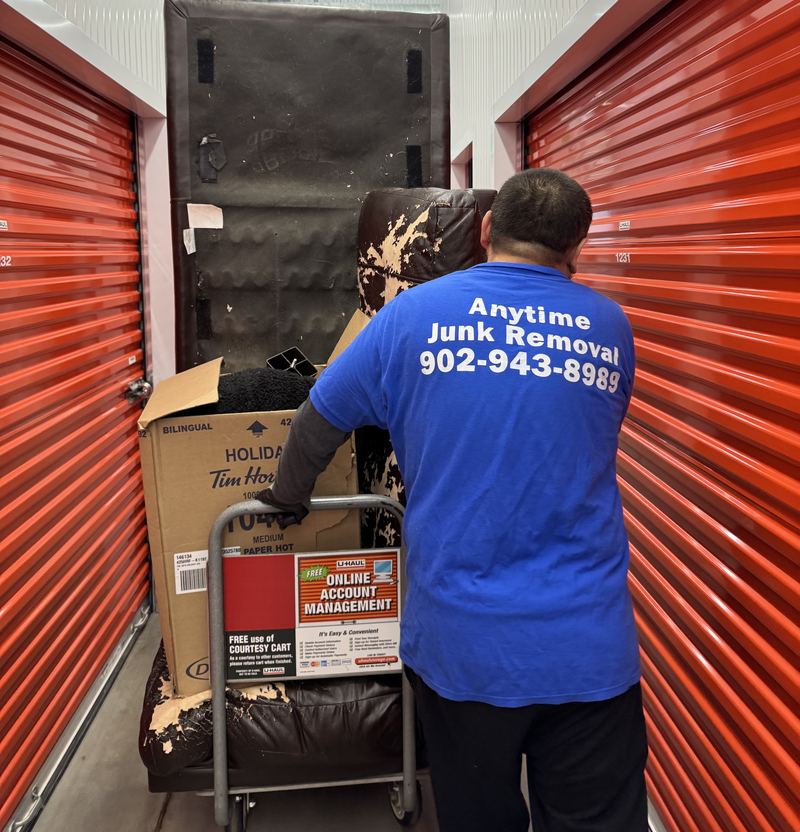 Anytime Junk Removal crew member clearing a storage unit in Halifax